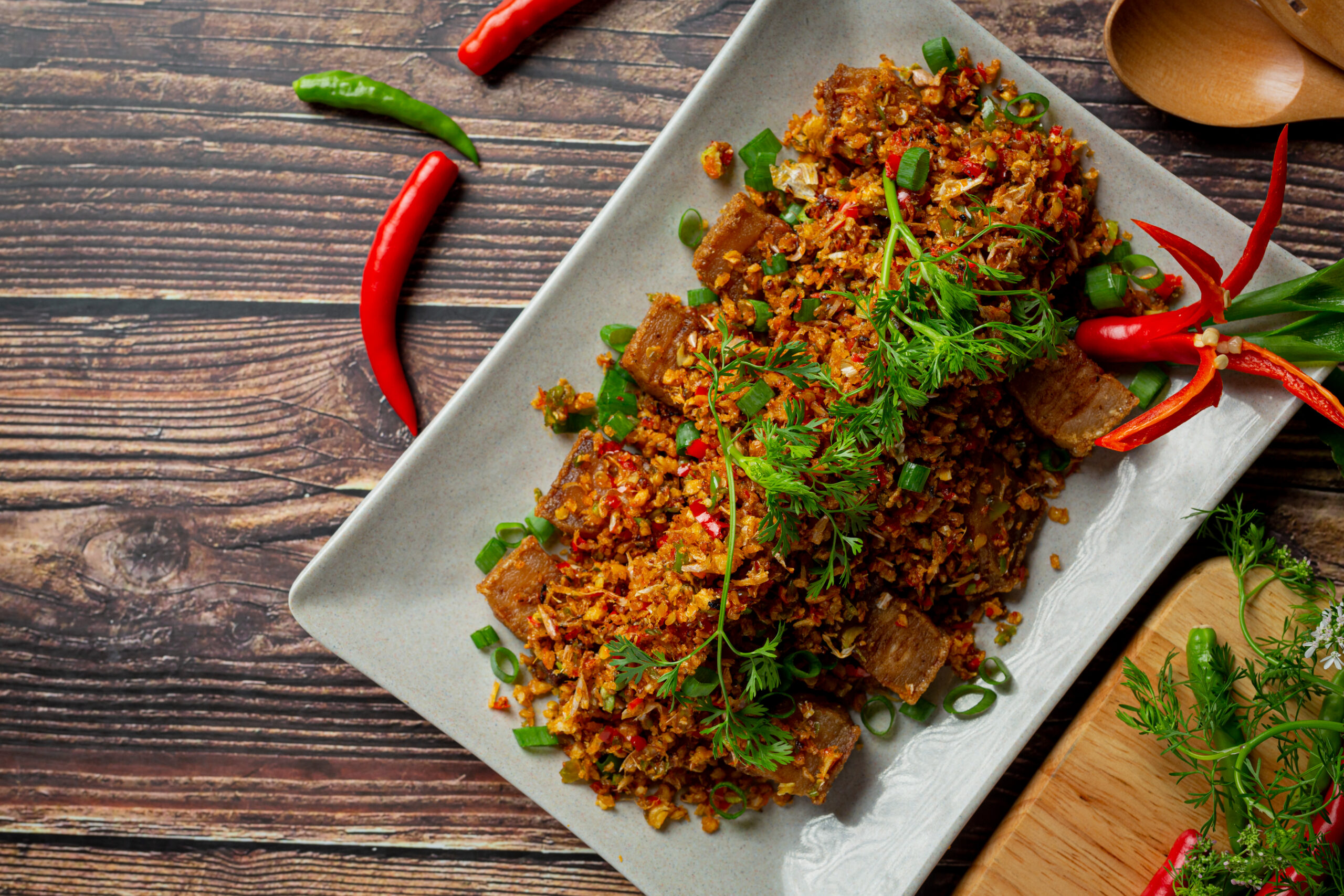 Fried Pork with Dried Chili and Salt on dark background Fried Pork with Dried Chili and Salt on dark background